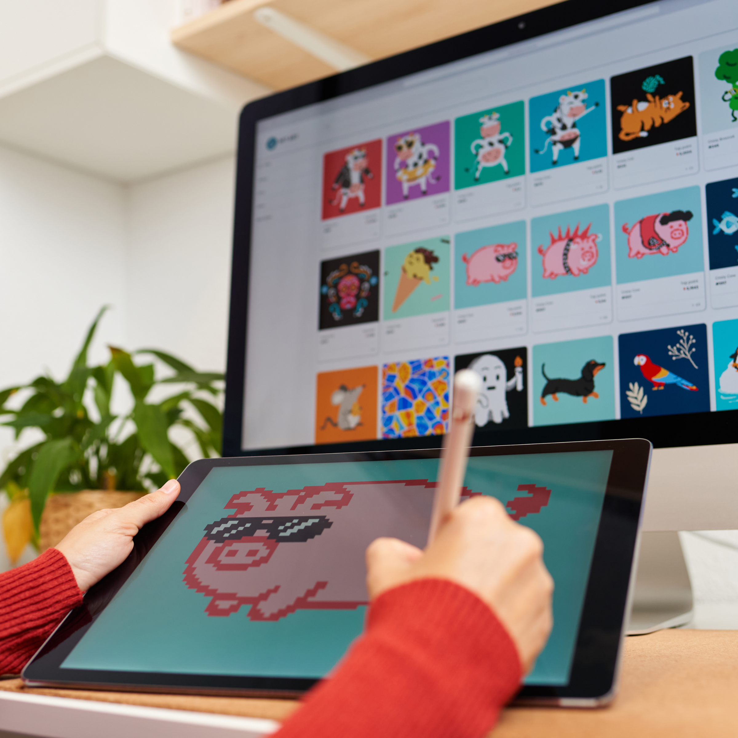 A person working on creating digital art printables on a computer.